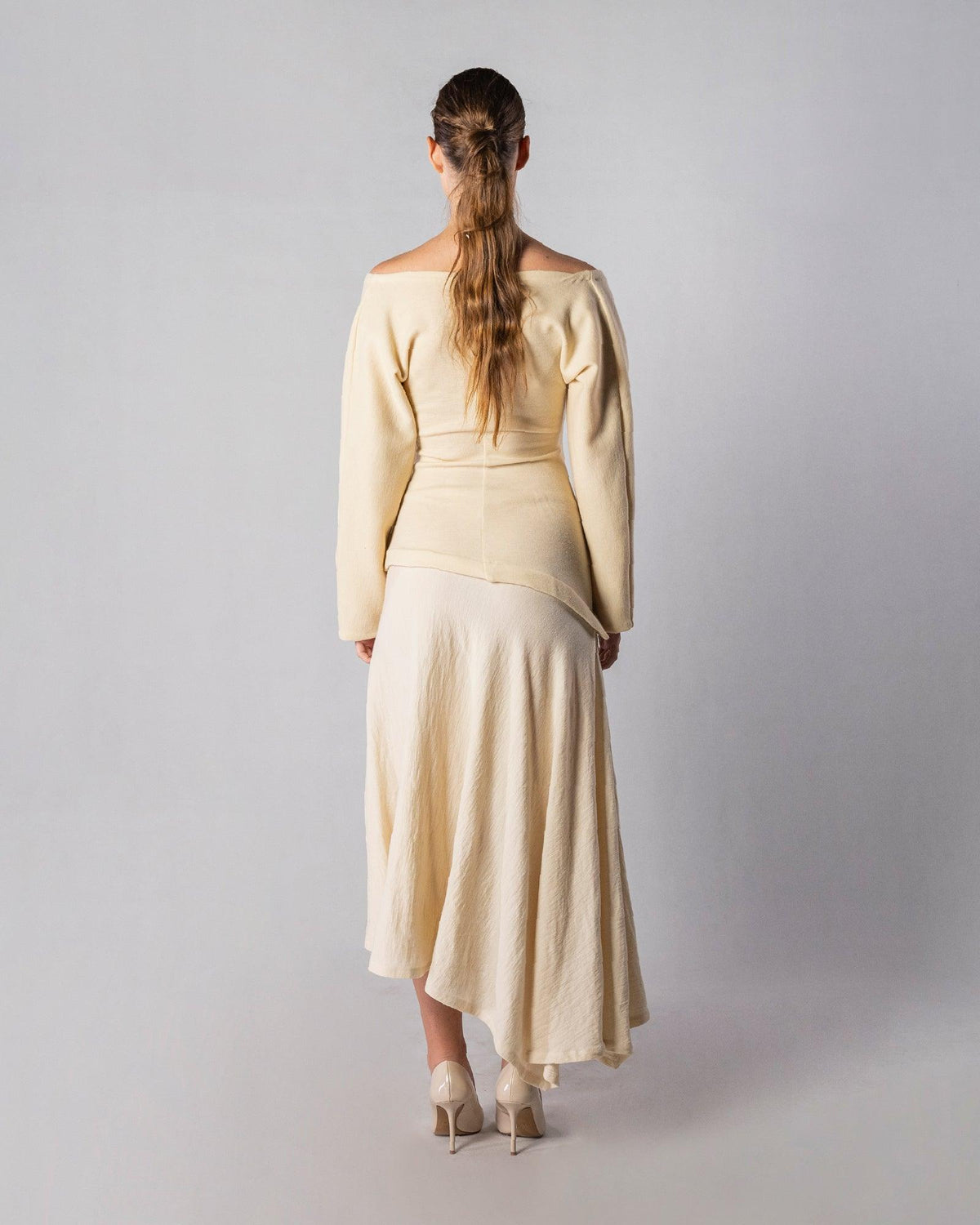 ALISADUDAJ CRAFT 08 off-white wool wrap top and midi skirt set, back view showing off-shoulder neckline and flared skirt, wool