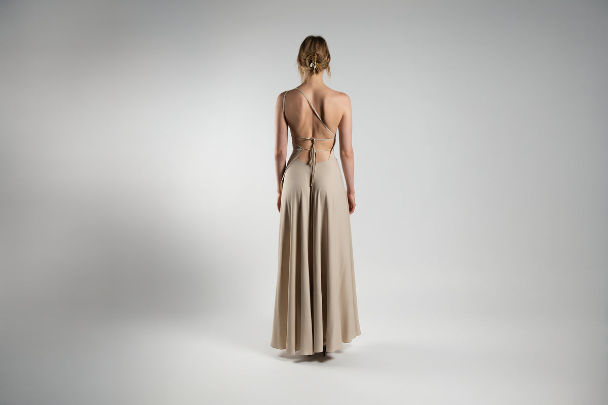 ALISADUDAJ beige cotton-twill one-shoulder maxi dress, back view showing open back with criss-cross tie straps