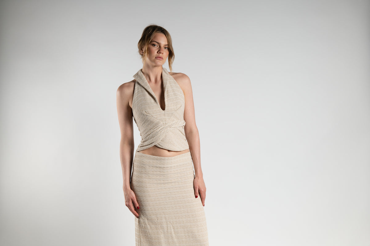 ALISADUDAJ beige linen halter top, half-length view showing collar, deep V and twisted wrap front