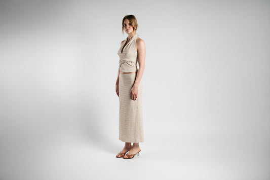 ALISADUDAJ beige linen halter top and maxi skirt set, front three-quarter view showing collared halter neckline