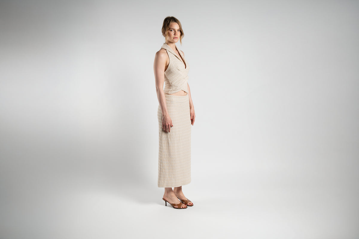 ALISADUDAJ beige linen halter top and maxi skirt set, side view showing twisted front and column skirt