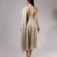 ALISADUDAJ beige linen and viscose one-shoulder draped dress, back view showing open back, zip and textured waist panel