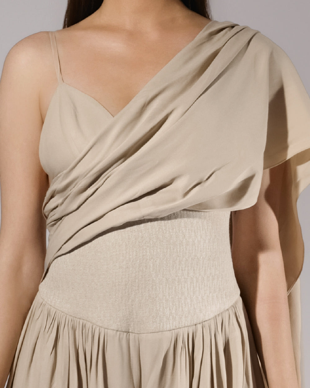 ALISADUDAJ beige linen and viscose one-shoulder draped dress, close-up of crossover drape and textured waistband
