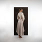 ALISADUDAJ beige wool asymmetric dress, back view showing high-low hem and full sleeves