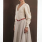 ALISADUDAJ beige wool asymmetric dress, close-up of deep V neckline, bishop sleeves and red embroidered waist motif