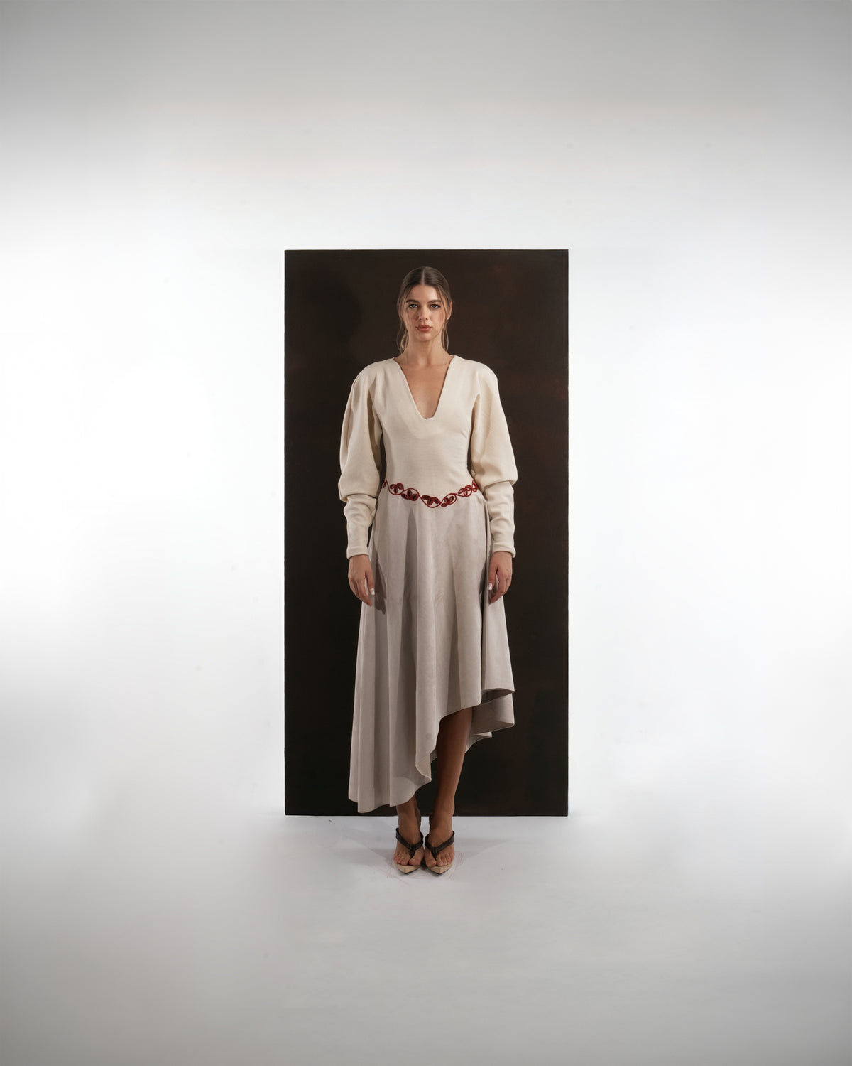 ALISADUDAJ beige wool asymmetric dress with red embroidered waist, front view, full length