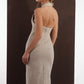ALISADUDAJ beige wool halterneck column dress, back close-up of open back, zip and skirt slit, wool blend