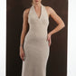 ALISADUDAJ beige wool halterneck column dress, three-quarter view with hand on hip, half length