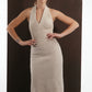 ALISADUDAJ beige wool halterneck column dress, front view with hands on hips showing bodice texture