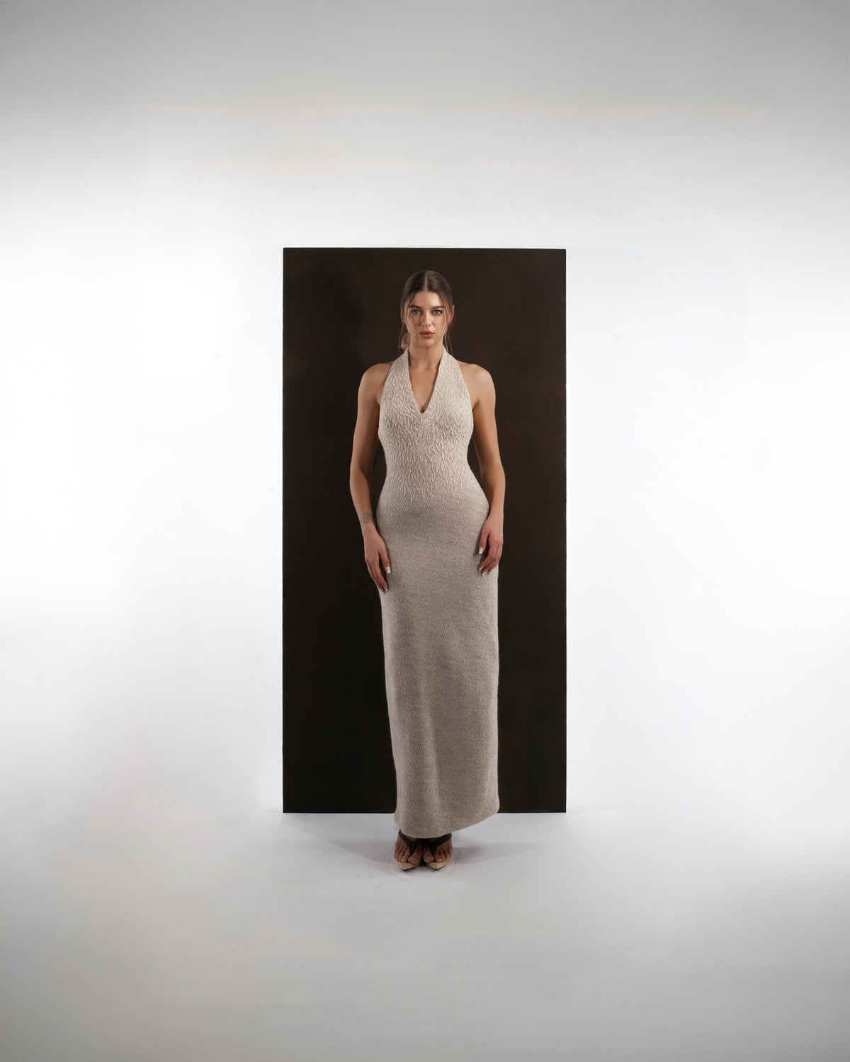 ALISADUDAJ beige wool halterneck column dress, front view, full length, showing textured bodice and V neckline