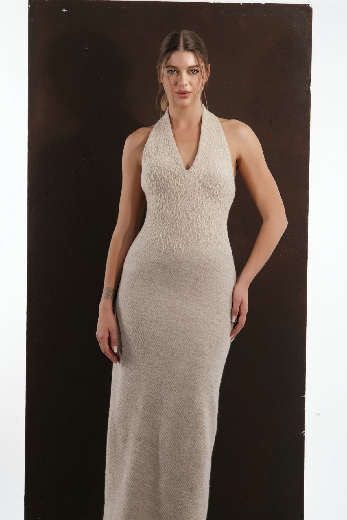ALISADUDAJ beige wool halterneck column dress, half-length front view showing textured knit bodice