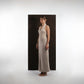 ALISADUDAJ beige wool halterneck column dress, side three-quarter view showing slim column silhouette