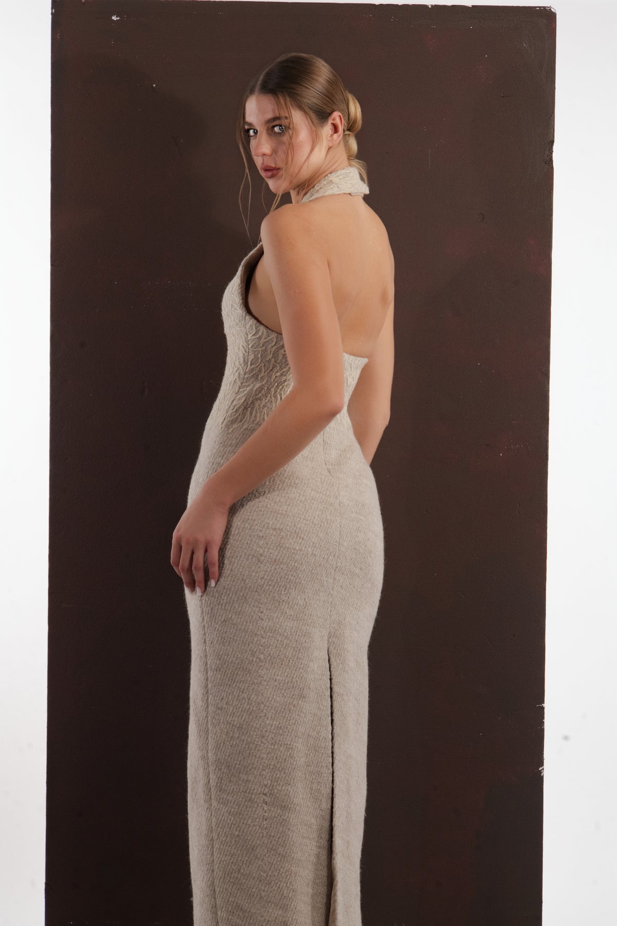 ALISADUDAJ beige wool halterneck column dress, side back view showing halter collar and open back