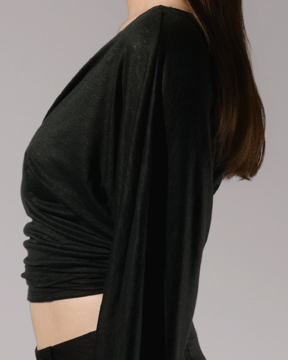 ALISADUDAJ black linen deep-V wrap top and midi skirt set, side close-up of batwing sleeve and ruched wrap top