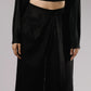 ALISADUDAJ black linen deep-V wrap top and midi skirt set, close-up of skirt waistband, button and wrap drape