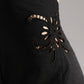 ALISADUDAJ black linen halter cut-out dress, close-up of floral embroidered cut-out detail at side waist