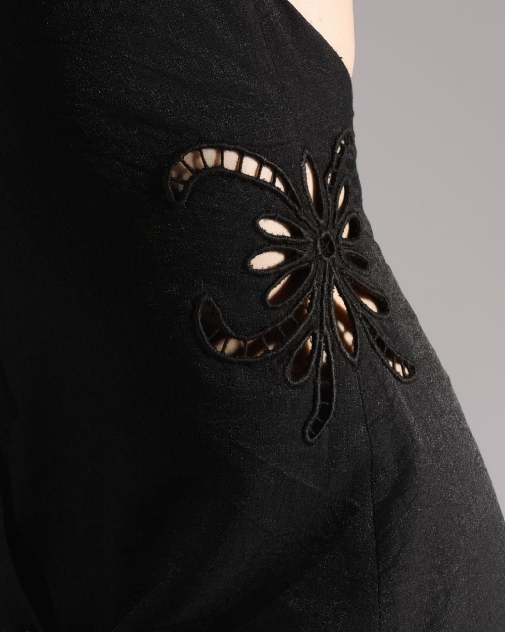 ALISADUDAJ black linen halter cut-out dress, close-up of floral embroidered cut-out detail at side waist