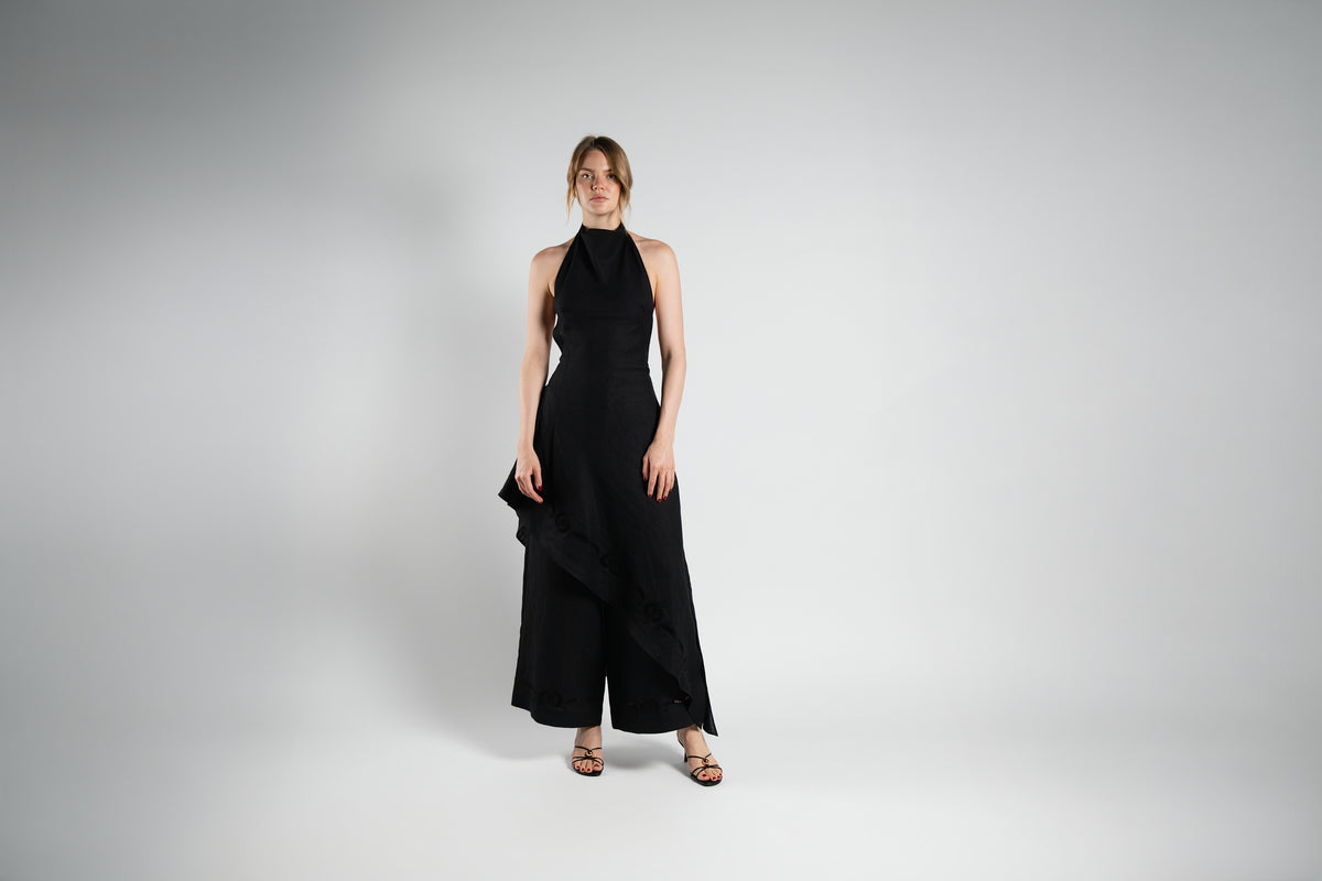 ALISADUDAJ black linen halter dress and wide-leg trouser set, front view, full length, showing asymmetric ruffle hem