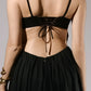 ALISADUDAJ black linen strappy evening dress, close-up of lace-up back tie and gathered waist