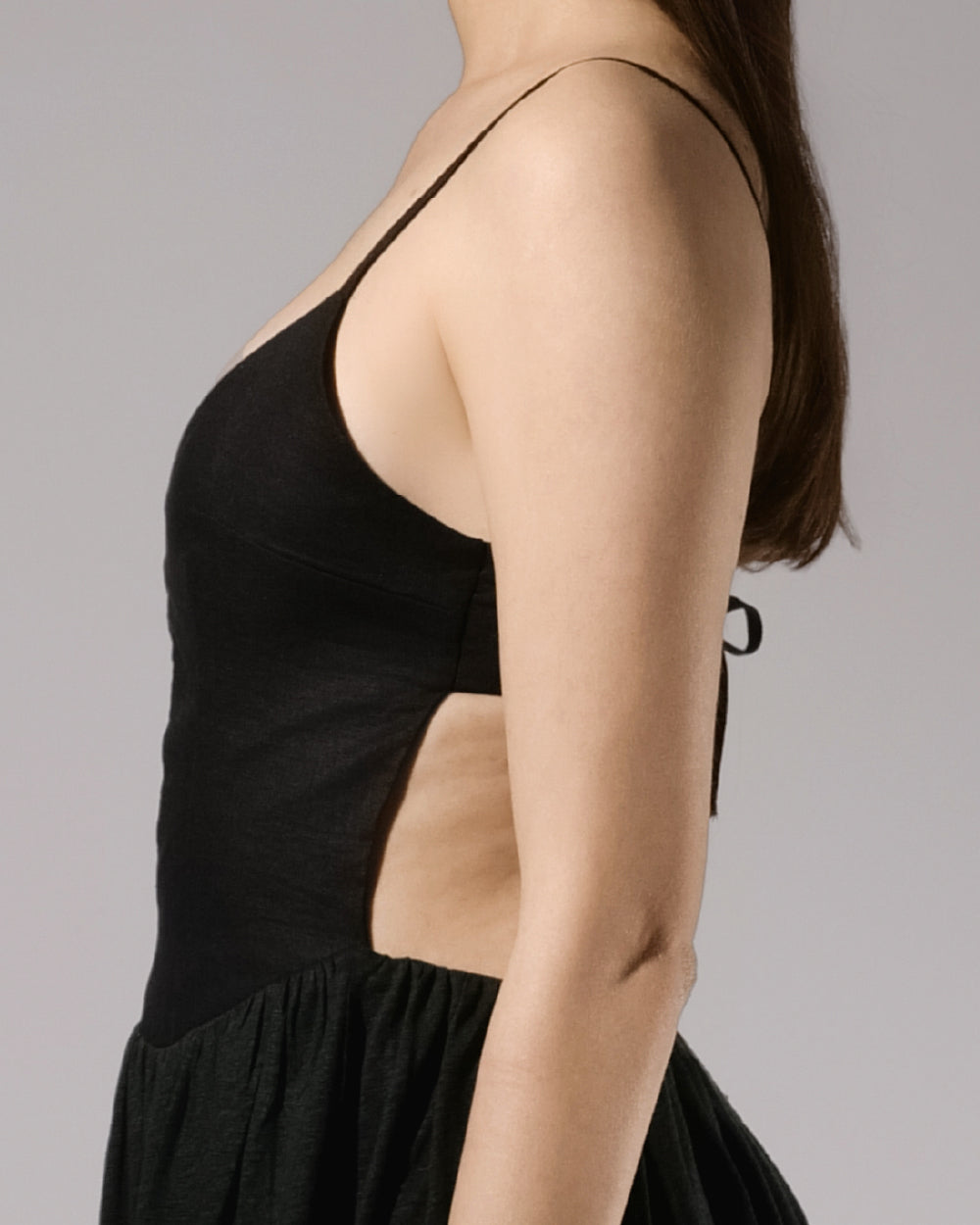 ALISADUDAJ black linen strappy evening dress, side close-up of thin strap and bodice edge