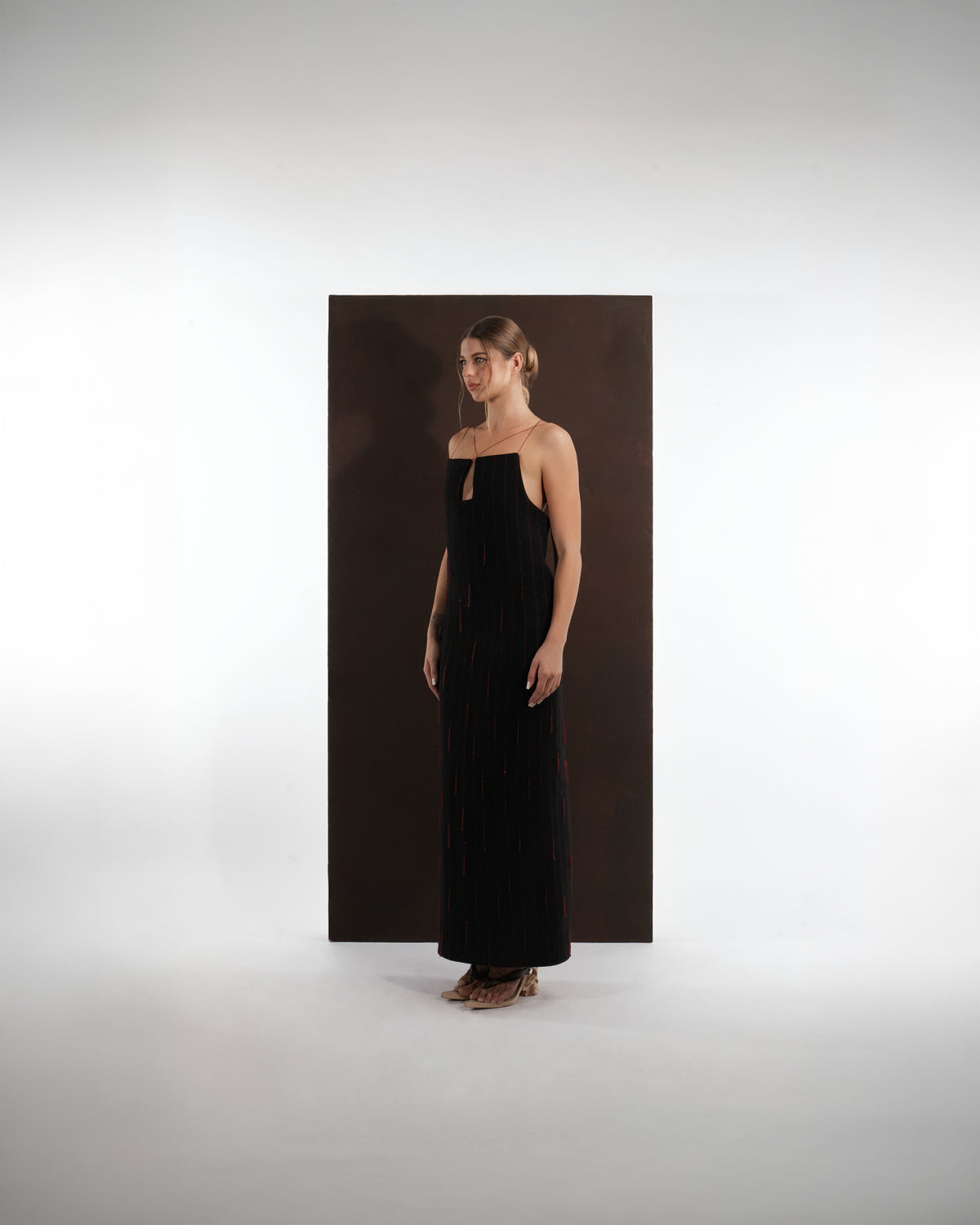 ALISADUDAJ black and red pinstripe wool maxi dress, front three-quarter view showing straight neckline and deep armhole