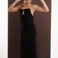 ALISADUDAJ black and red pinstripe wool maxi dress, three-quarter view in movement showing slim column shape