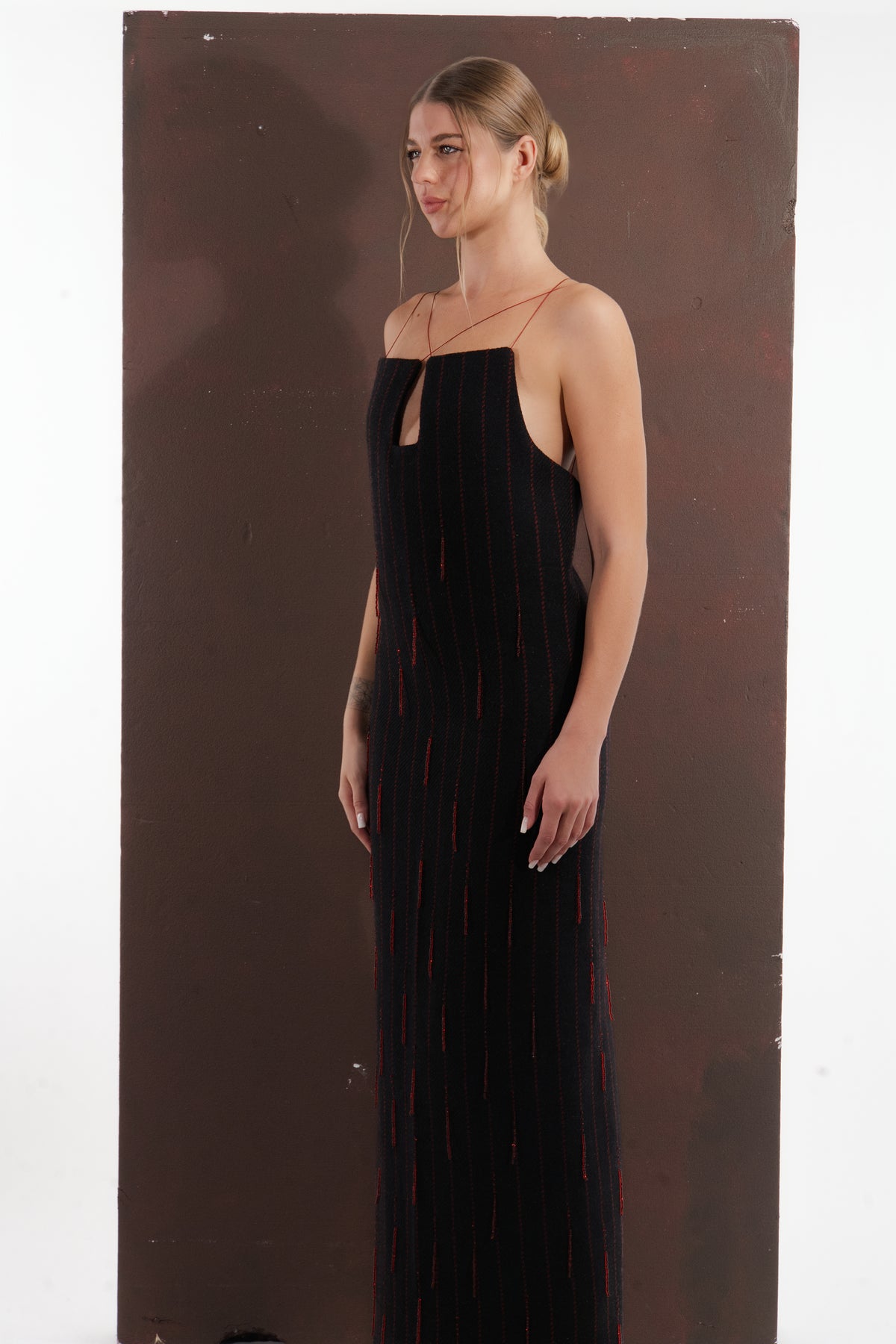 ALISADUDAJ black and red pinstripe wool maxi dress, side three-quarter view showing column silhouette