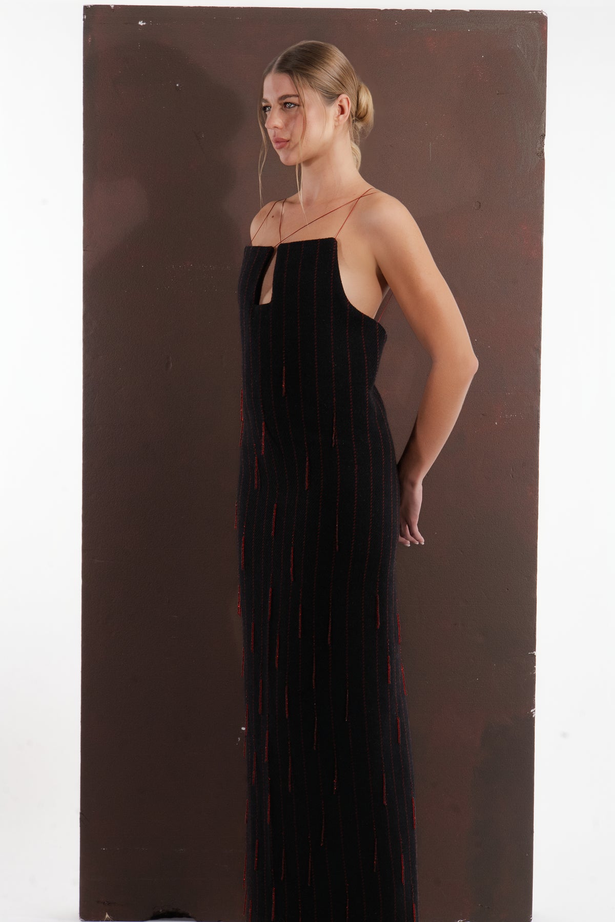 ALISADUDAJ black and red pinstripe wool maxi dress, side profile showing open side and slim fit
