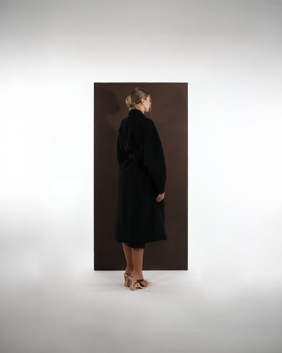 ALISADUDAJ black wool belted wrap coat, back view showing full-length silhouette and dropped shoulders