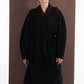 ALISADUDAJ black wool belted wrap coat, front view showing rounded sleeve volume and belted waist