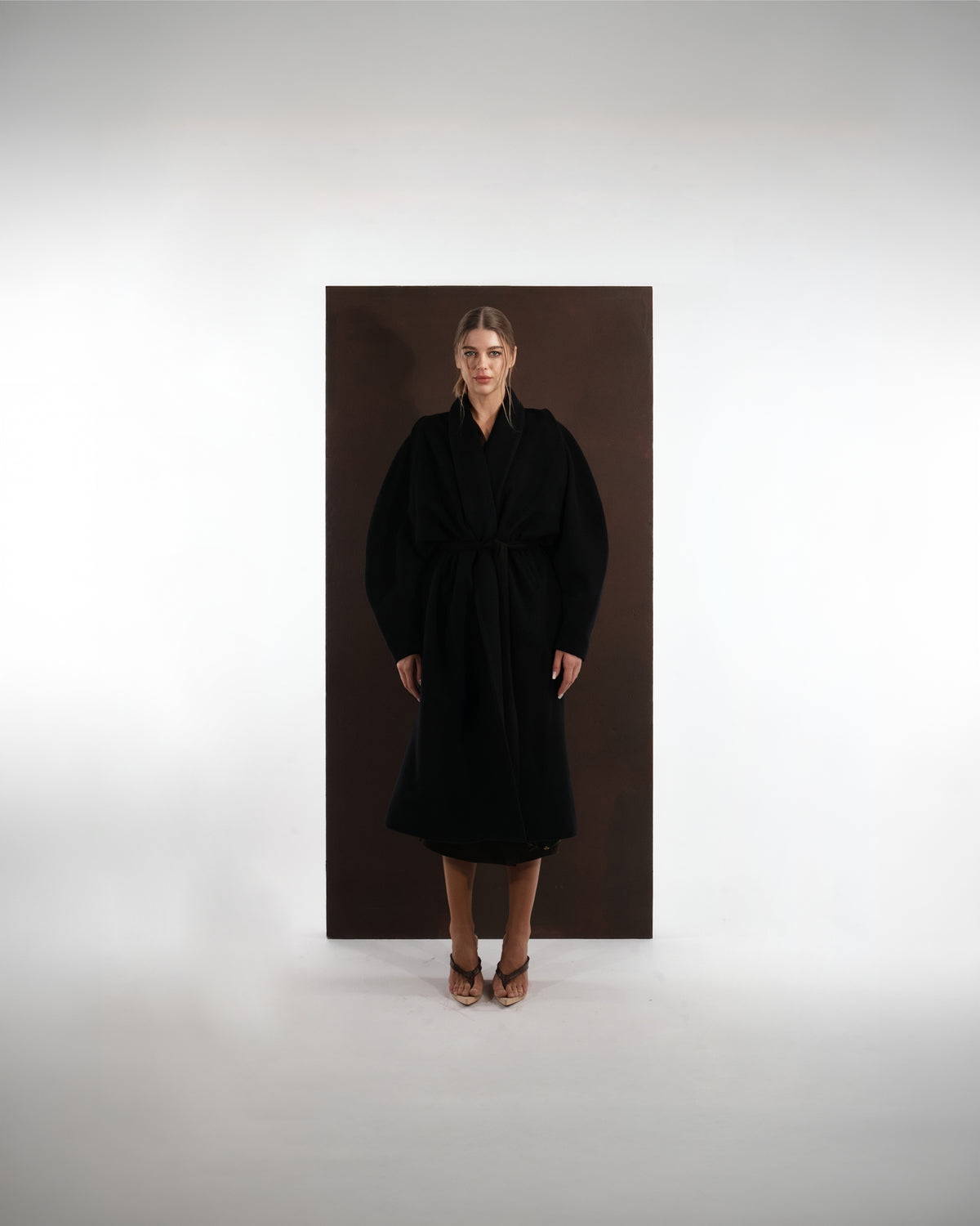 ALISADUDAJ black wool belted wrap coat, front view, full length, showing shawl collar and tie belt