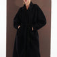 ALISADUDAJ black wool belted wrap coat, half-length front view showing shawl collar, belt and pockets, wool blend