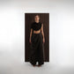 ALISADUDAJ black wool draped cowl top and draped trouser set, front view showing cropped cowl drape and waist panel