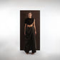 ALISADUDAJ black wool draped cowl top and trouser set, front three-quarter view showing draped overlay across the trousers