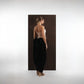 ALISADUDAJ black wool draped harem trousers, back view showing gathered drape and tapered ankle