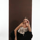 ALISADUDAJ black wool draped harem trousers, crouching side view showing gathered volume