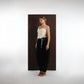 ALISADUDAJ black wool draped harem trousers, front three-quarter view showing low draped crotch