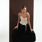 ALISADUDAJ black wool draped harem trousers, three-quarter crouching view with ivory felted corset, wool blend