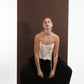 ALISADUDAJ black wool draped harem trousers, crouching front view showing full width of the drape
