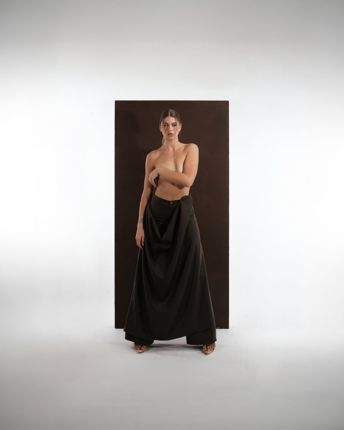 ALISADUDAJ black wool draped wide-leg trousers, front view showing full drape falling to the floor