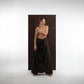ALISADUDAJ black wool draped wide-leg trousers, three-quarter view showing draped overlay and wide leg
