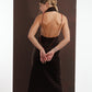 ALISADUDAJ brown wool garden-embroidered wrap dress, back view with hands clasped showing beaded halter strap, wool blend