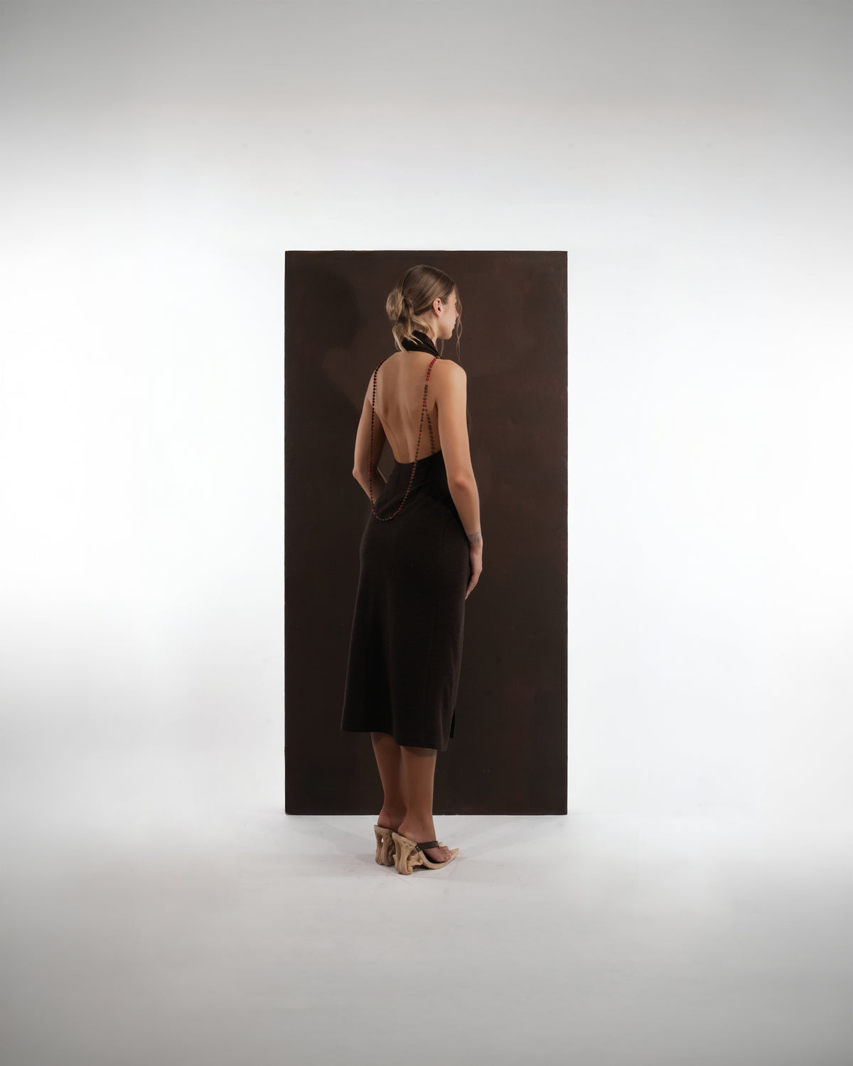 ALISADUDAJ brown wool garden-embroidered wrap dress, back view showing open back and beaded halter strap