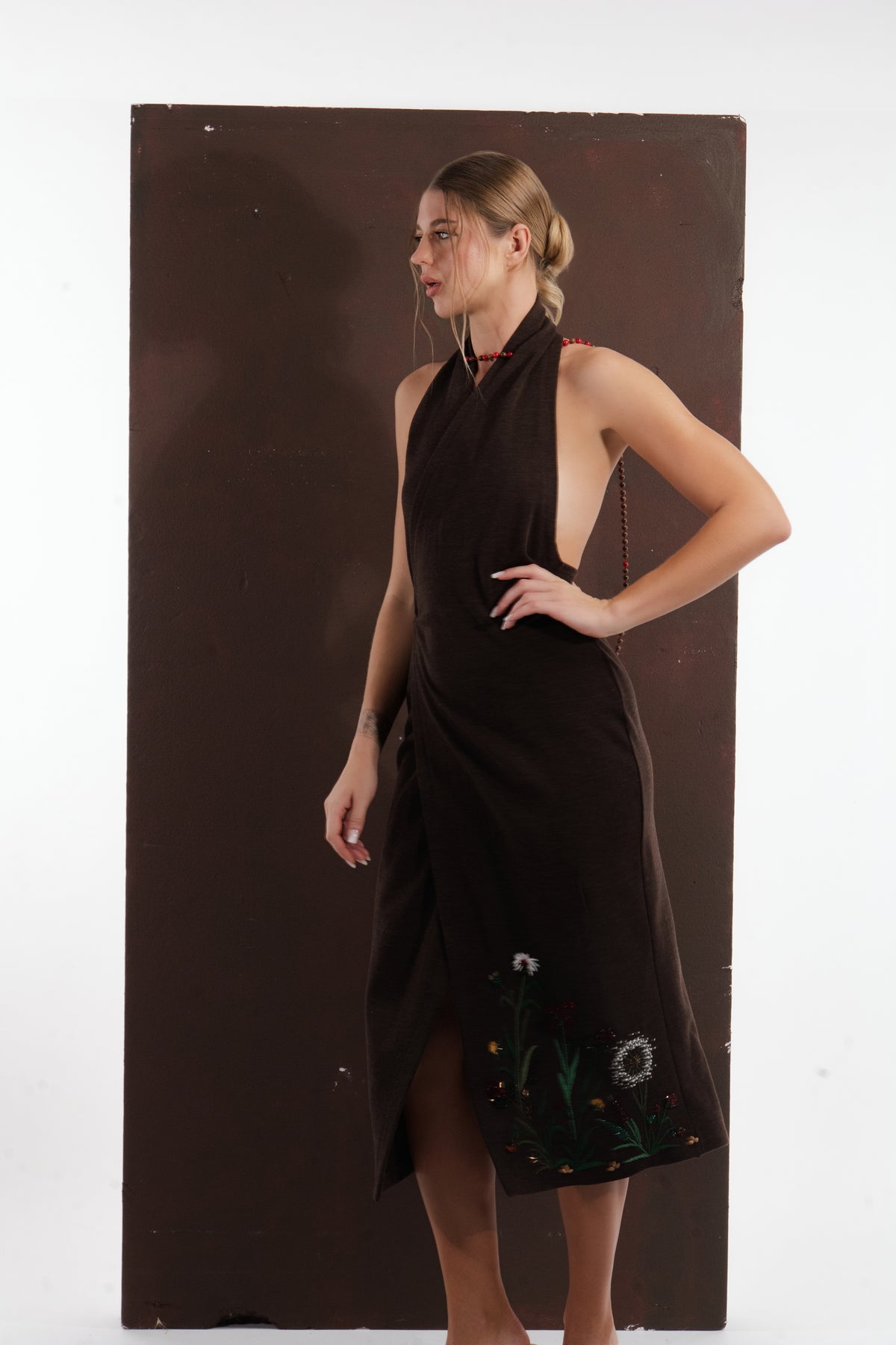 ALISADUDAJ brown wool garden-embroidered wrap dress, side view showing wrap slit and embroidered garden motif