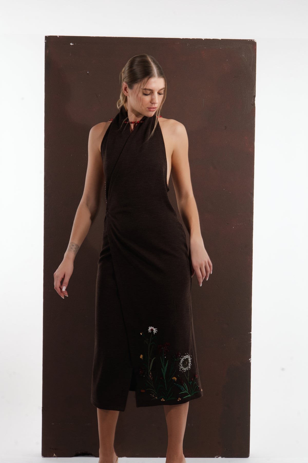 ALISADUDAJ brown wool garden-embroidered wrap dress, front view showing wrap closure and embroidered wildflowers at the hem