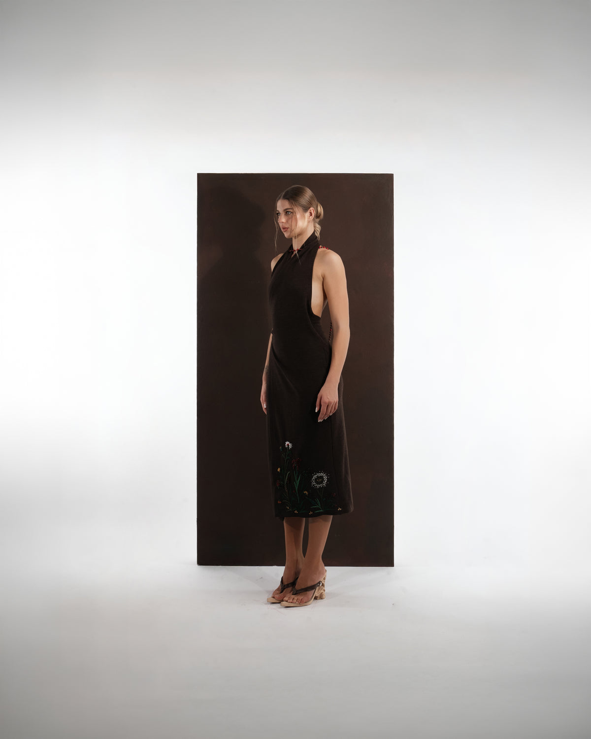 ALISADUDAJ brown wool garden-embroidered wrap dress, side three-quarter view showing wrap skirt and floral embroidery