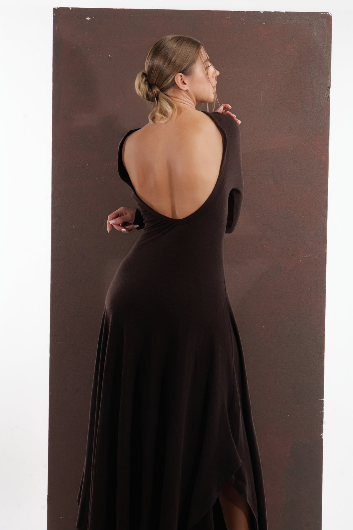ALISADUDAJ brown wool open-back maxi dress, back view looking over shoulder showing open back