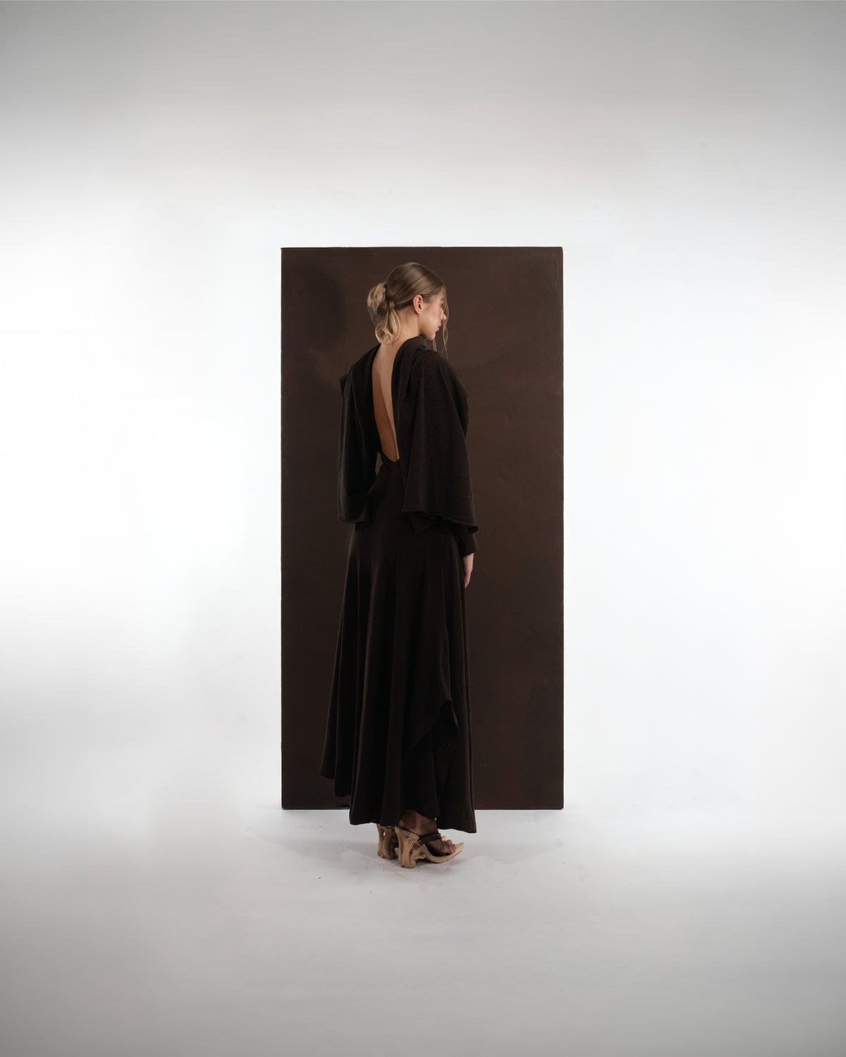 ALISADUDAJ brown wool open-back maxi dress, back view showing deep open back with draped shawl