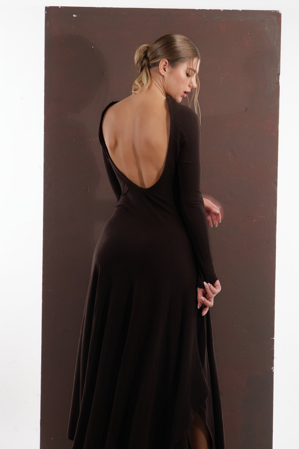 ALISADUDAJ brown wool open-back maxi dress, back view showing scooped open back and flared asymmetric hem