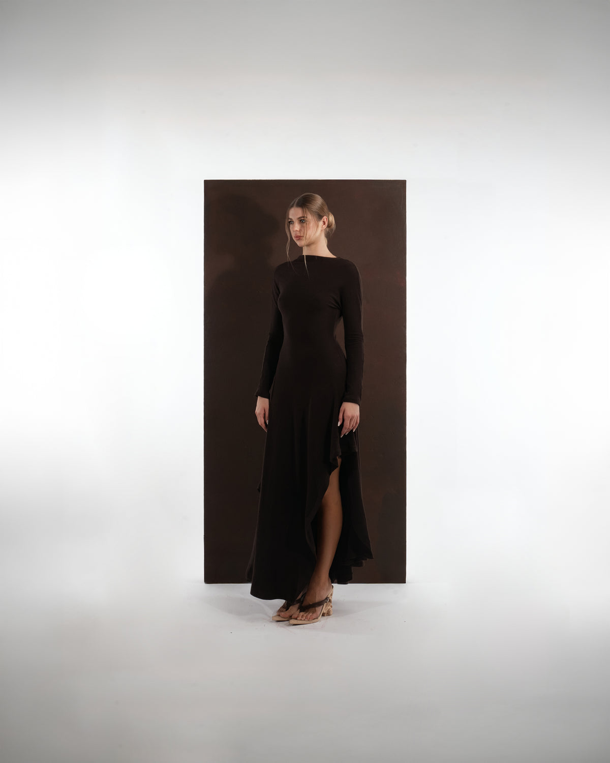 ALISADUDAJ brown wool open-back maxi dress, front three-quarter view showing high neckline and leg slit